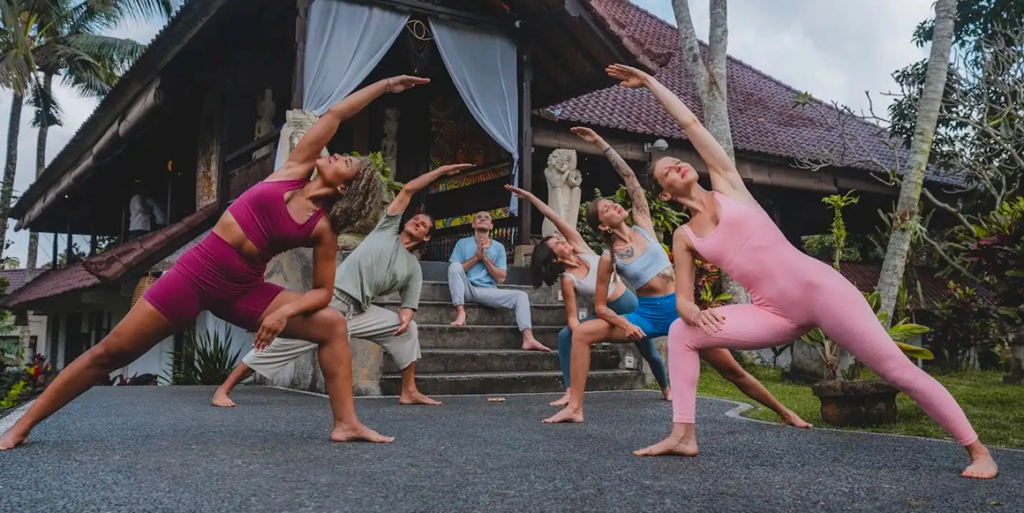Yoga students practicing a group asana session during Yoga Teacher Training at House of Om Bali.