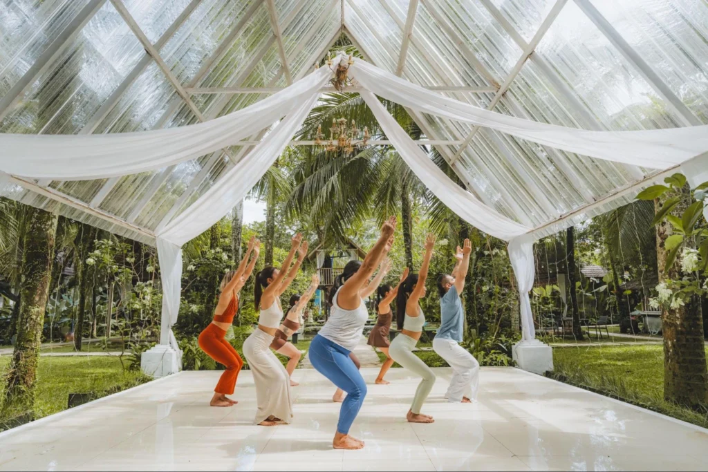 Yoga students meditating together during a House of Om training session in Bali