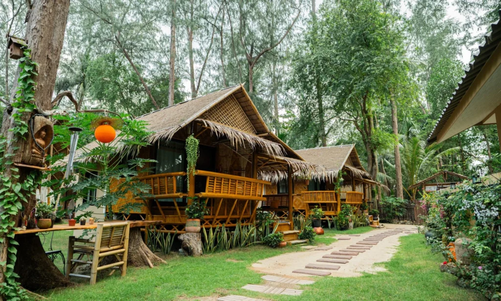 House of Om bamboo accommodation and tropical grounds at the Thailand yoga training location