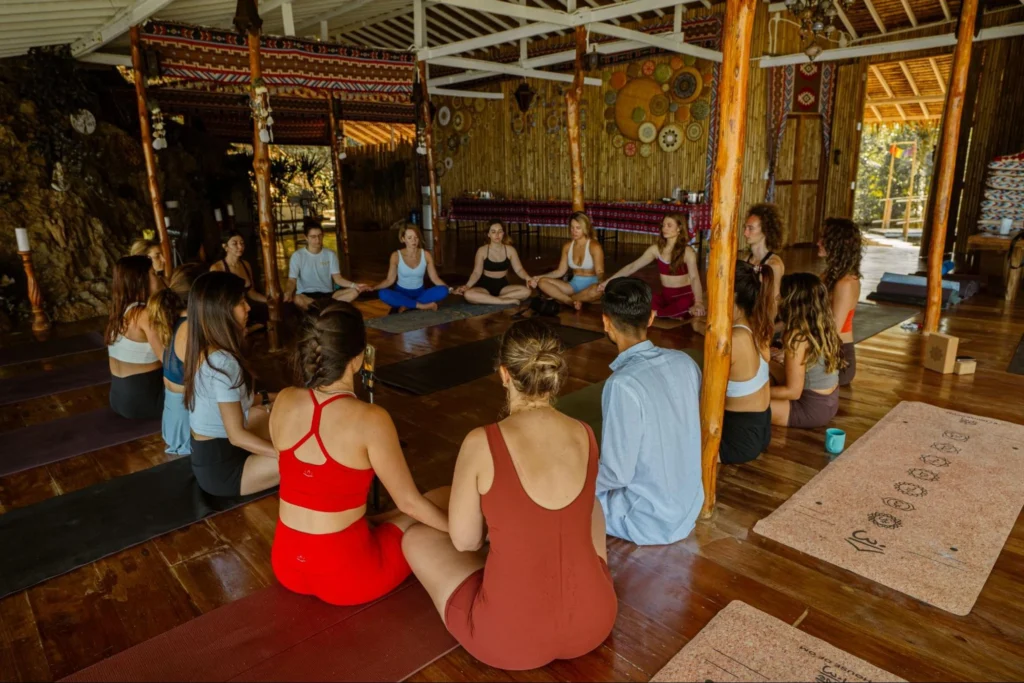 Yoga teacher training students sitting together in a meditation circle at House of Om Thailand