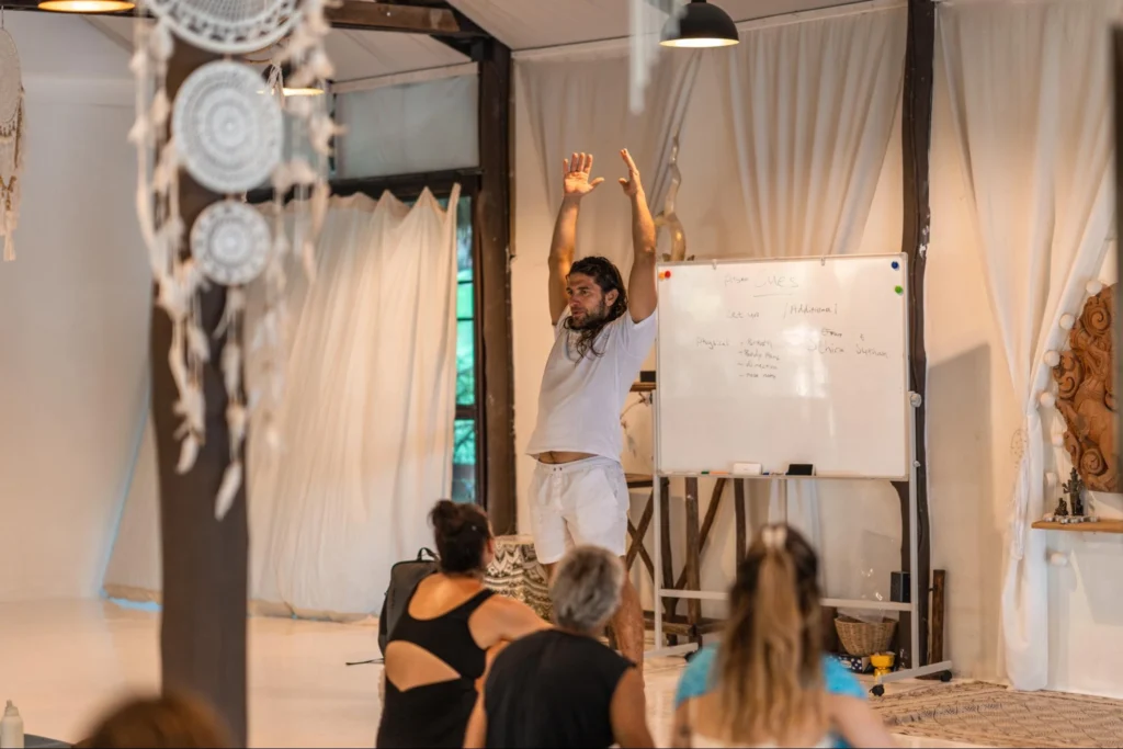 Yoga teacher leading an educational session during 200-hour teacher training in Thailand