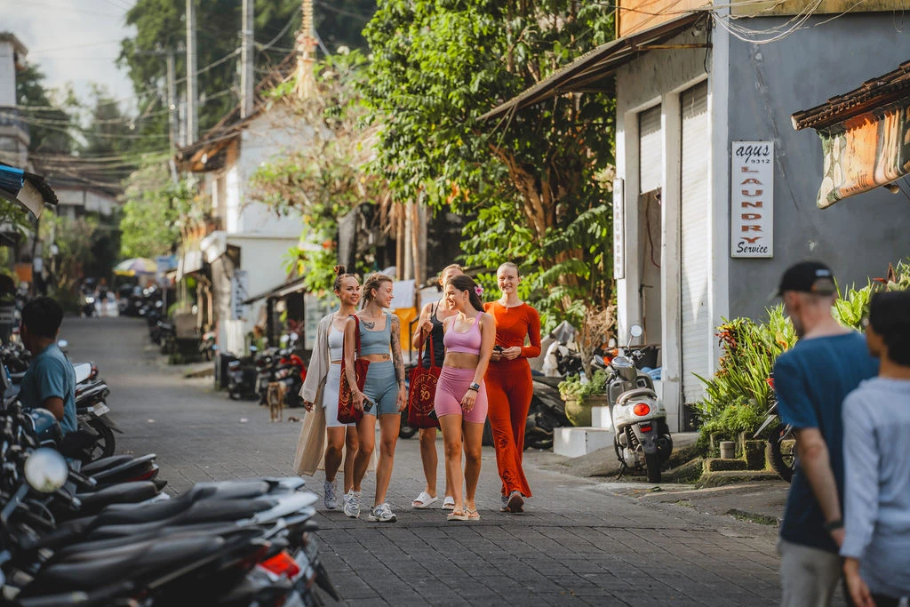 Yoga teacher training students walking through Ubud during free time between training sessions
