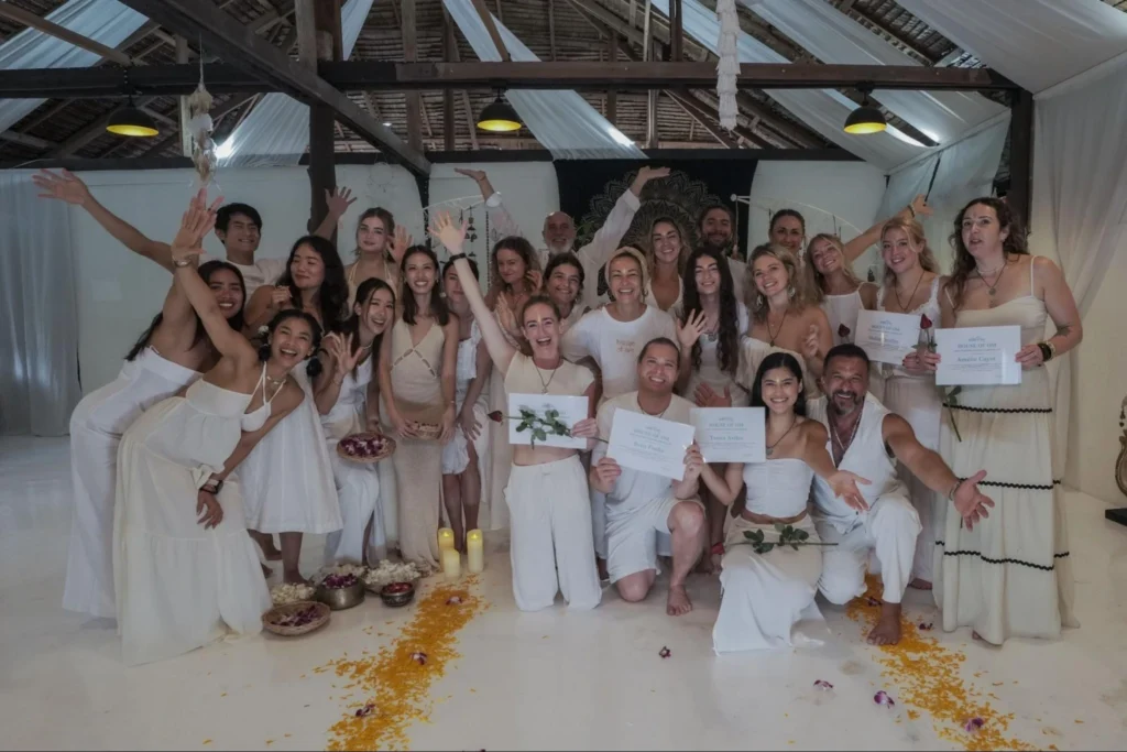 House of Om graduates holding yoga teacher training certificates in Thailand