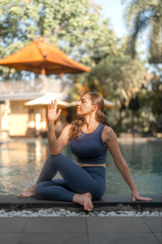 Yoga student practicing seated twist pose during yoga teacher training in Bali