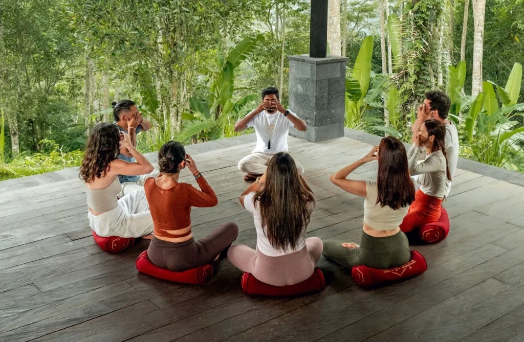 Students practicing breathwork during advanced yoga teacher training in Bali