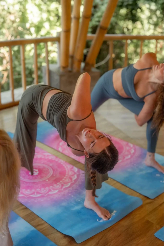 Yoga students practicing backbend poses in the Amertham yoga shala