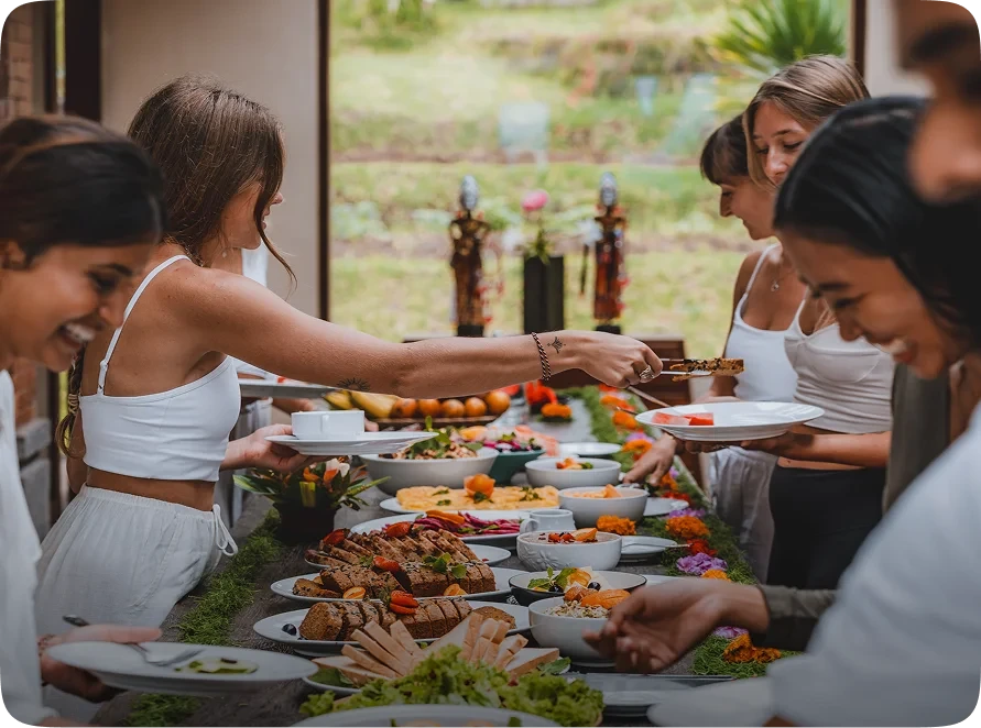 Yoga teacher training students enjoying a healthy group meal in Bali