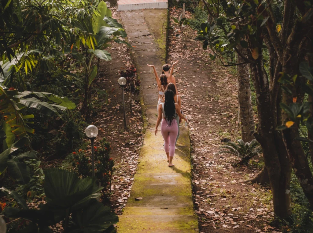 Aerial view of a House of Om yoga teacher training venue surrounded by tropical forest in Bali