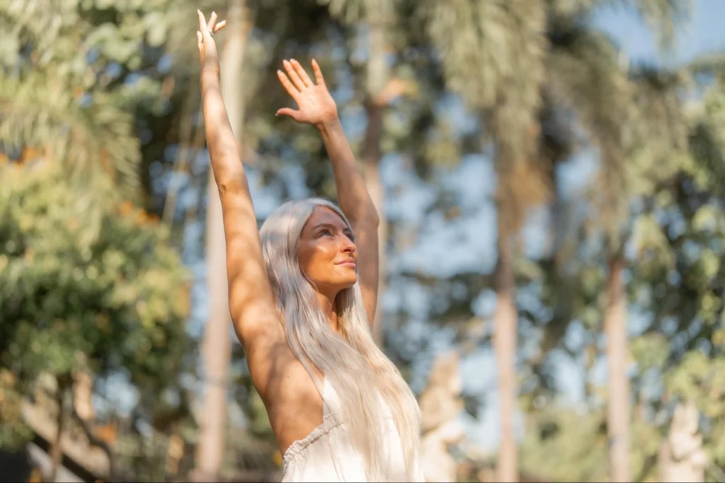 1. Yoga student stretching upward during outdoor yoga practice in Bali