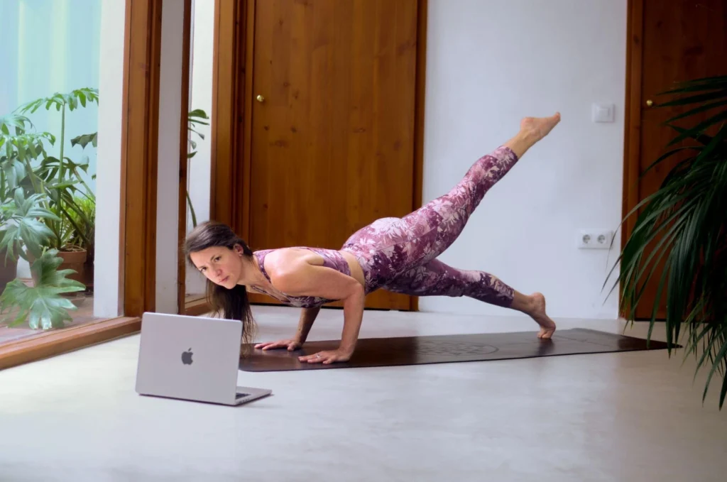 Yoga student practicing at home after completing online 200-hour teacher training