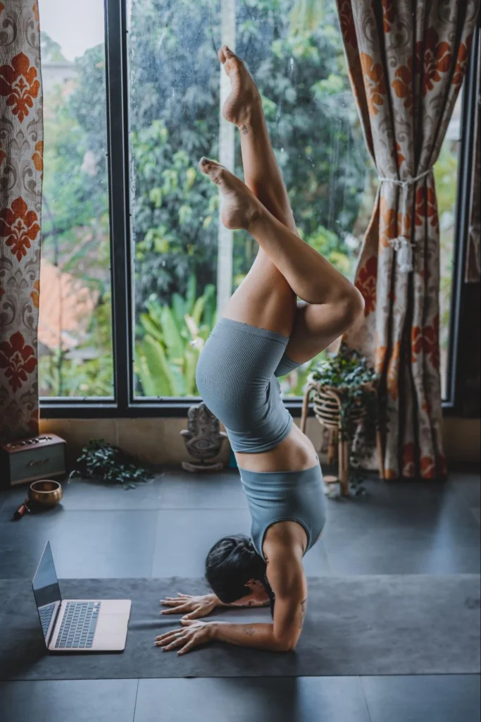 Student practicing advanced yoga during an online yoga teacher training program